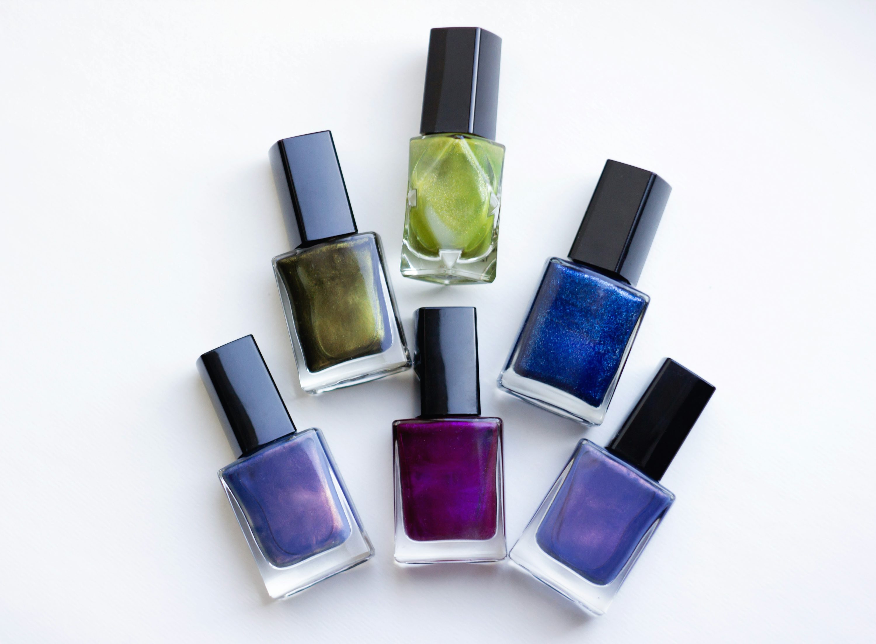 Illustrative group of colorful nail polish bottles